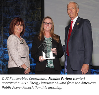OUC Renewables Coordinator Pauline Furfaro (center) accepts the 2015 Energy Innovator Award from the American Public Power Association this morning.