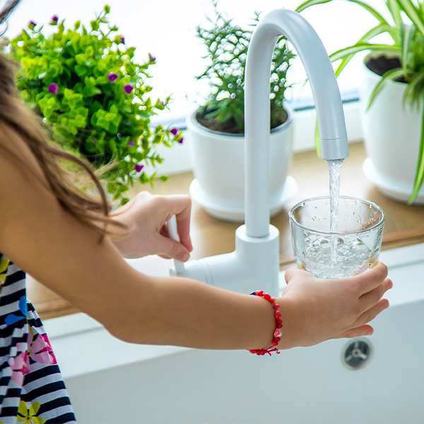 Kids Drinking Water and Smiling